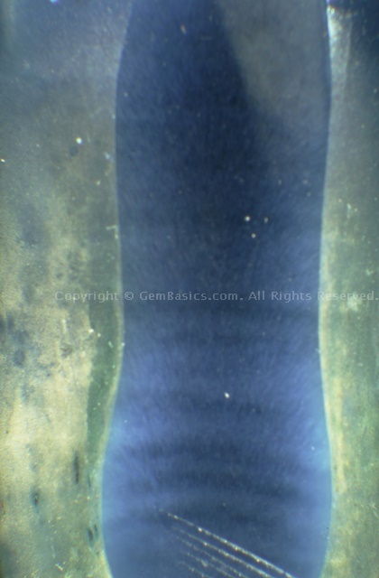 Curved striae in Verneuil synthetic sapphire boule